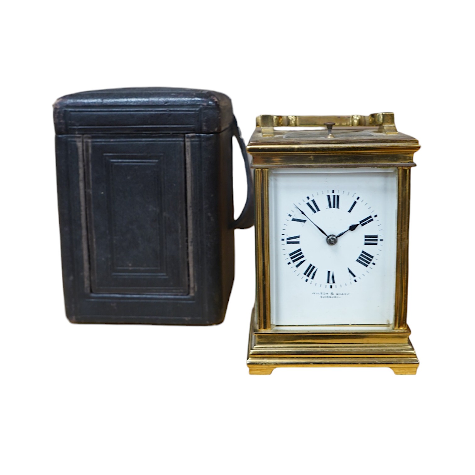 A late 19th century French brass cased eight day repeating carriage clock, Wilson & Sharp, in leather case. Condition - fair, not tested